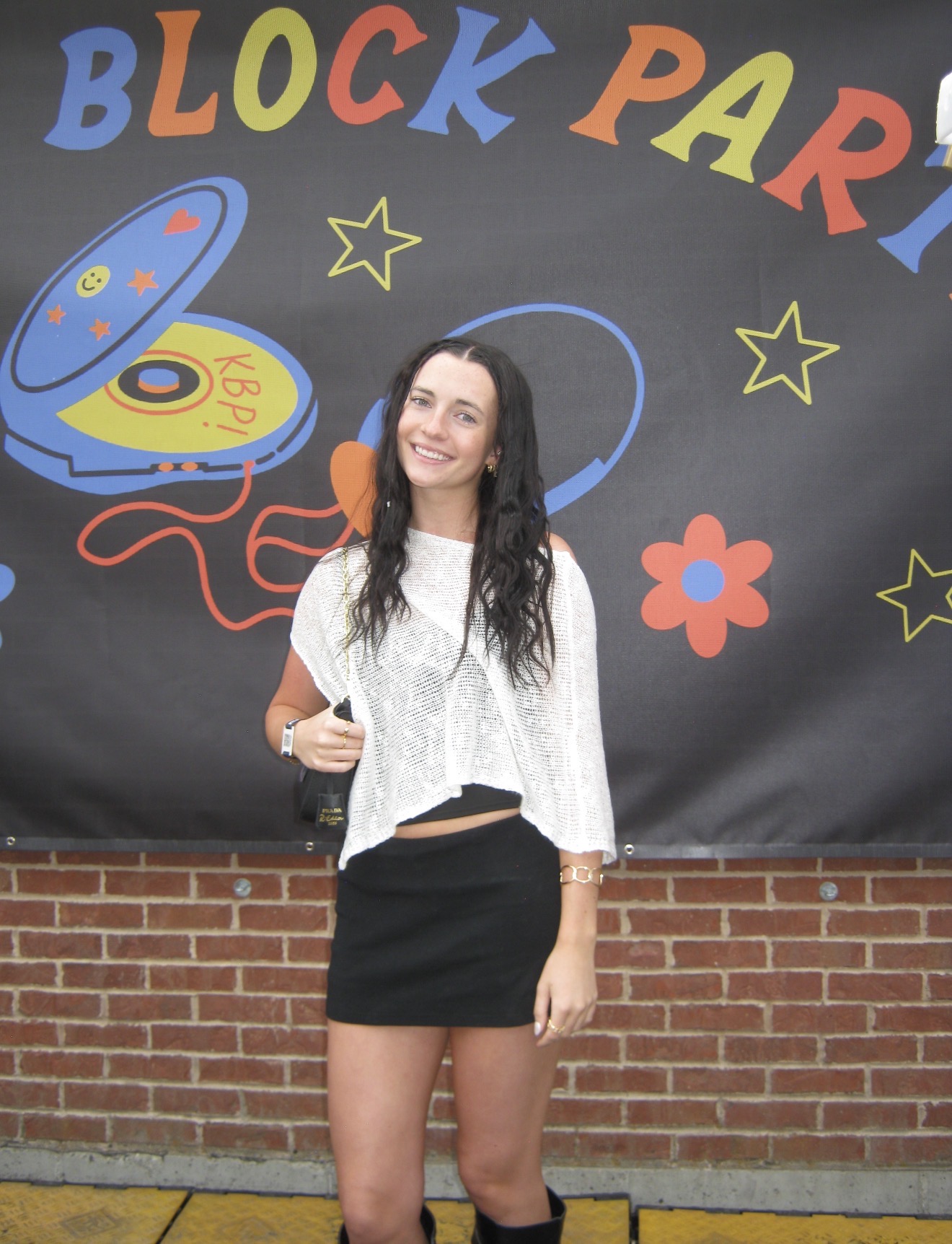 Brooklyn in front of the Kilby Block Party banner in Salt Lake City